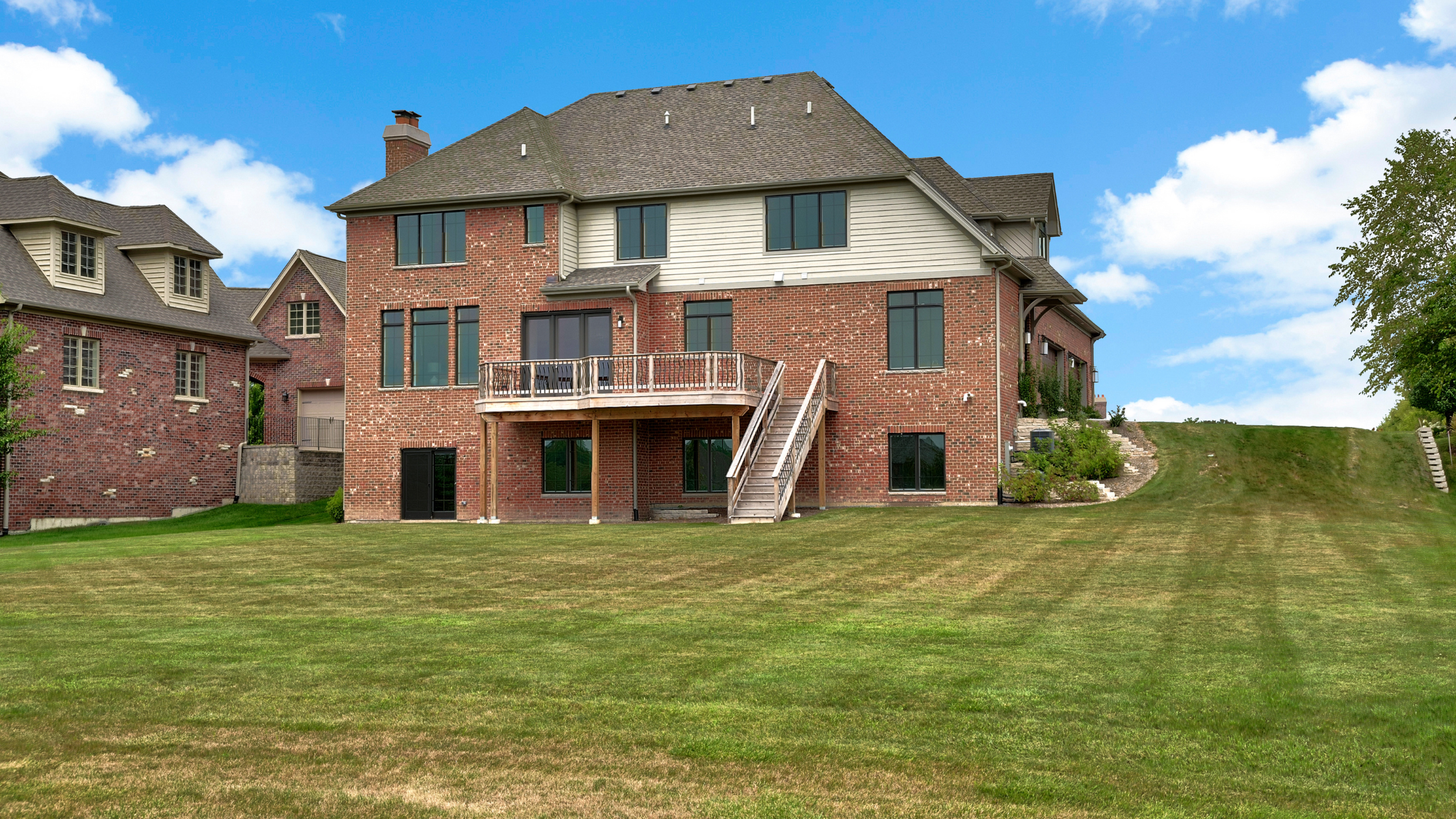 A photo of a large home with a walk out basement 