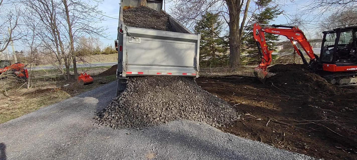 Dump truck spilling gravel