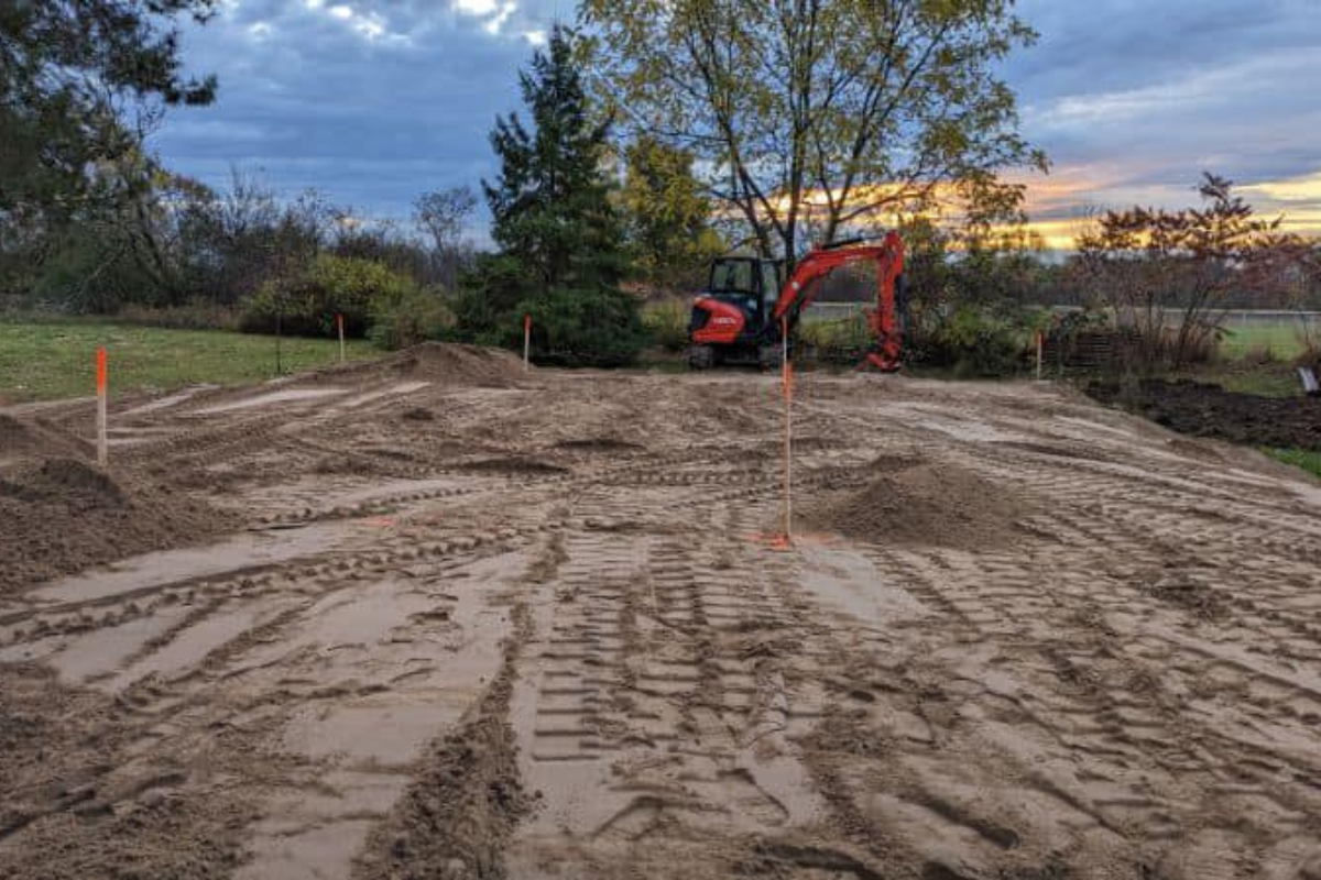 Final grading completed at sunset, with the system fully installed and the site levelled for stability and drainage.