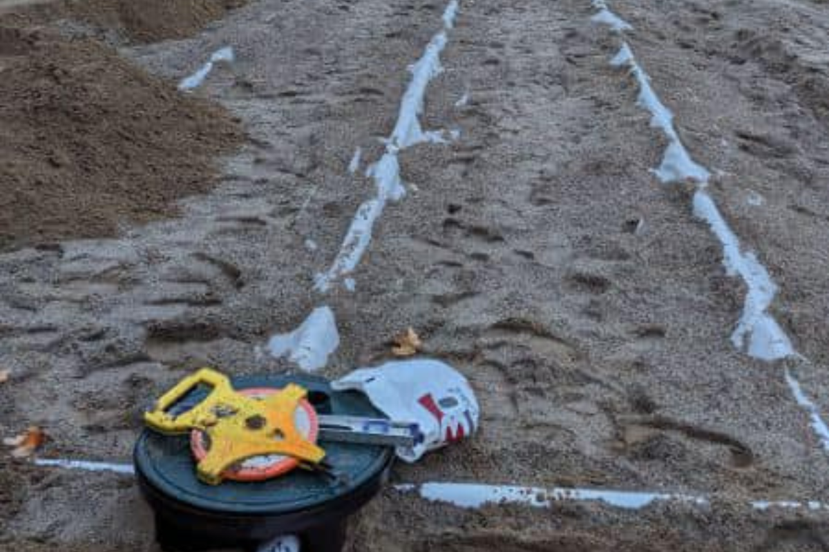 Final layout of Eljen system trenches marked and levelled, with geotextile fabric in place and distribution box sealed.