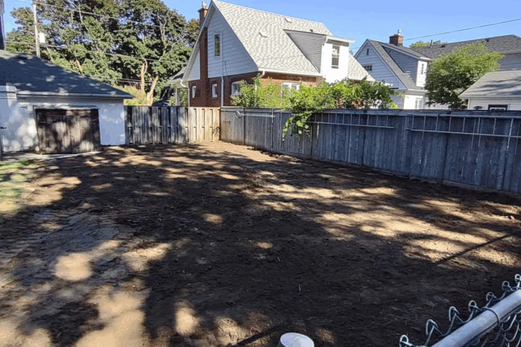 Backyard view after full pool removal, cleared and leveled for future use.