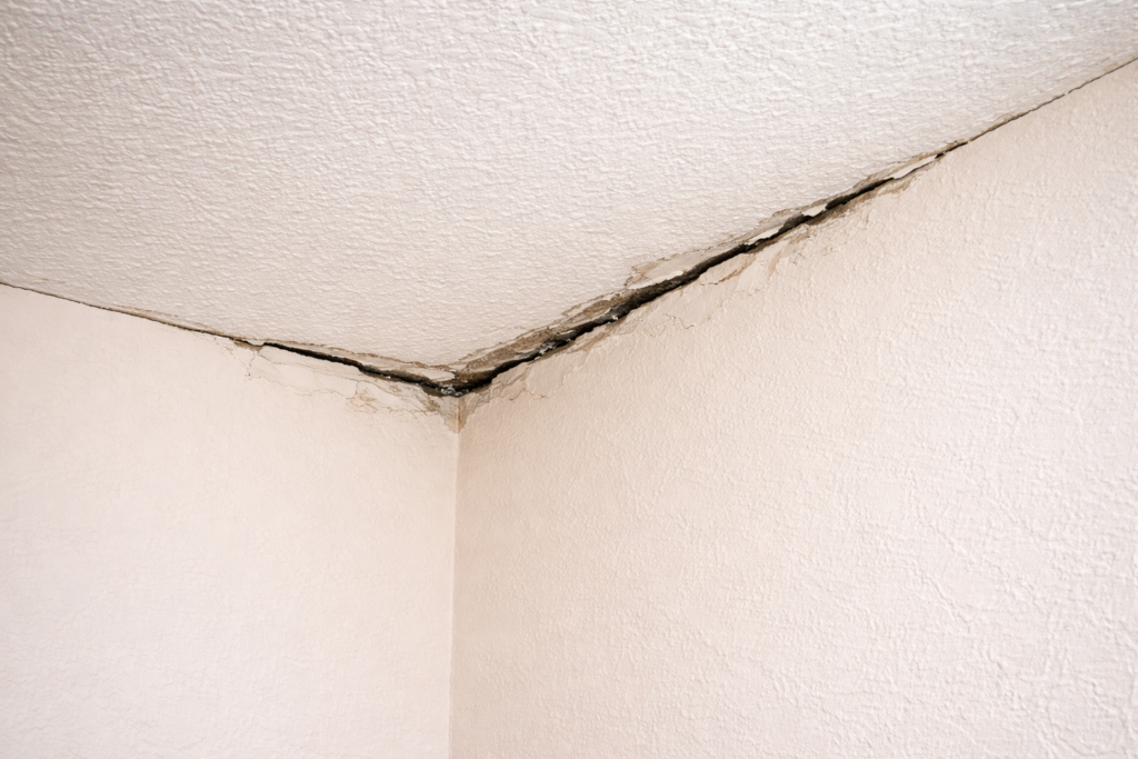 a gap between a wall and ceiling in a home.