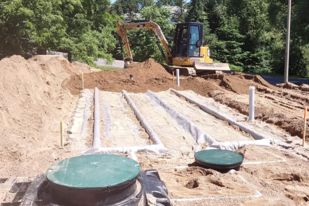 Septic system installation and leaching bed surrounded by soil. septic setback distances