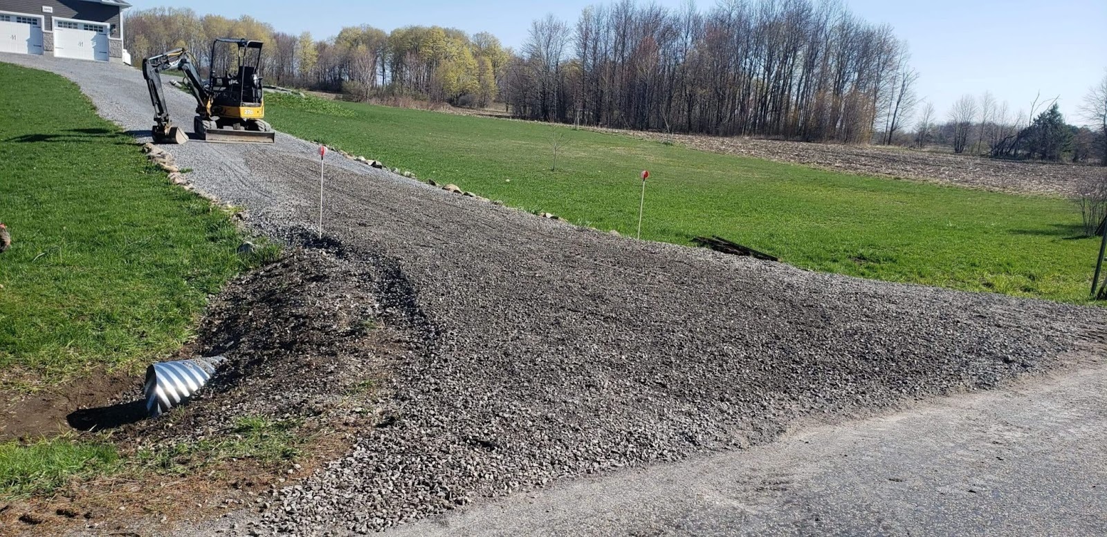 Driveway being regrated with gravel.