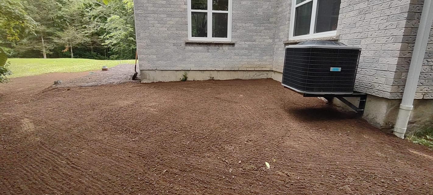 Grading around a homes foundation.